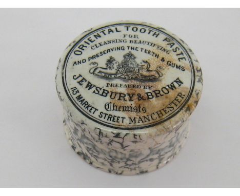 A ceramic pot and lid , the potlid transfer printed for  "Oriental tooth paste prepared by Jewsbury & Brown". 7cm. Diameter. 