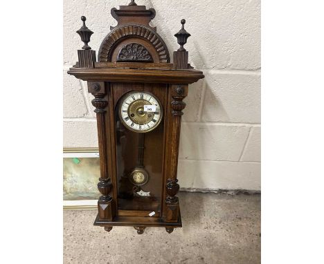 Late 19th or early 20th Century Vienna type wall clock in a carved architectural type case
