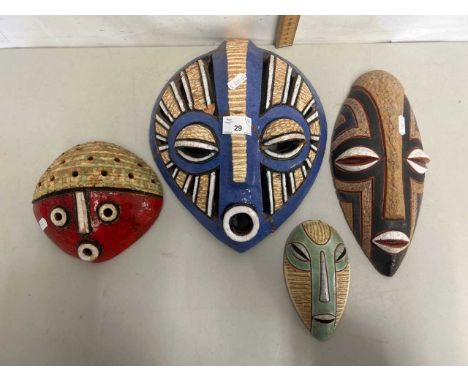 Group of four Congolese pottery masks, circa 1980's