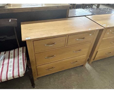Modern light wood four drawer chest with metal handles, 98cm wide