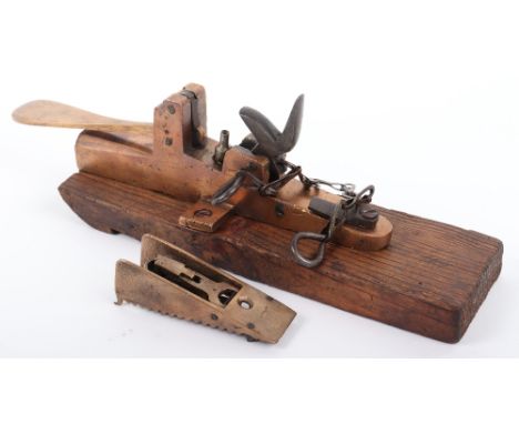 Brass Boxlock Percussion Door Alarm, with spoon handle front lever, hammer with chained safety pin, mounted on wooden block; 