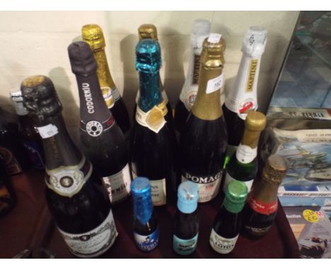 A Tray Containing Eight Bottles Champagne and Sparkling Wine Plus Five Smaller Bottles.