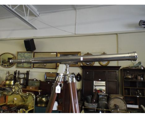 A Chromed Reproduction Telescope on Tripod.
