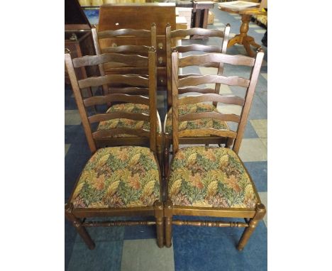 A Set of Four Oak Ladder Back Dining Chairs. 