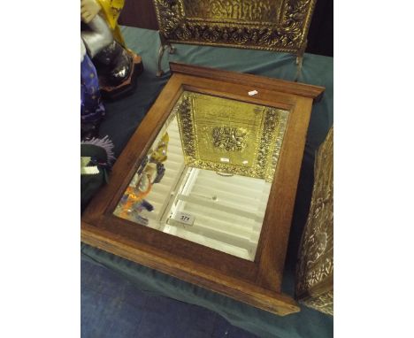 An Oak Framed Wall Mirror with Shelf.