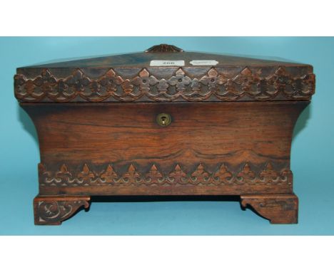 A Victorian rosewood tea caddy, of sarcophagus form, with Gothic style carved decoration, 33 cm wide   Condition report Repor