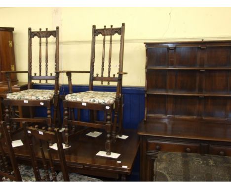 An oak bookcase, 108 cm wide, an Ercol dresser, an oak draw leaf dining table, and a set of six chairs (9)