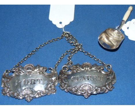 Two silver decanter labels, Port and Claret, London 1828, and a George III silver sugar scoop, London 1810 (3) Condition repo