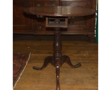 A 19th century oak tripod table, 68 cm diameter