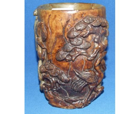A Chinese jade brush pot, carved birds amongst foliage (a.f.), 14 cm high Condition report Report by RB

Probably 20th centur