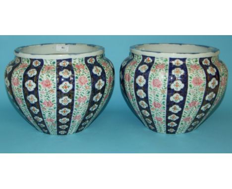 A pair of Chinese jardinieres, of lobed circular form, decorated panels of foliage in enamel colours, 29 cm diameter (2) Cond