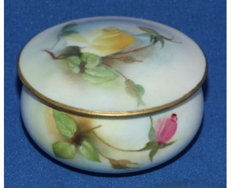 A Royal Worcester porcelain box and cover, decorated roses, (restored) 6.5 cm diameter