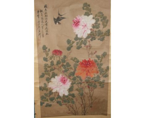 A Chinese painted scroll, decorated a bird amongst flowers and foliage, 173 cm high (overall)