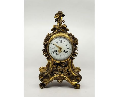 A 20th centruy French Louis XV style gilt bronze mantel clock, bell strike, movement stamped "Rack, French Mark", with domed 