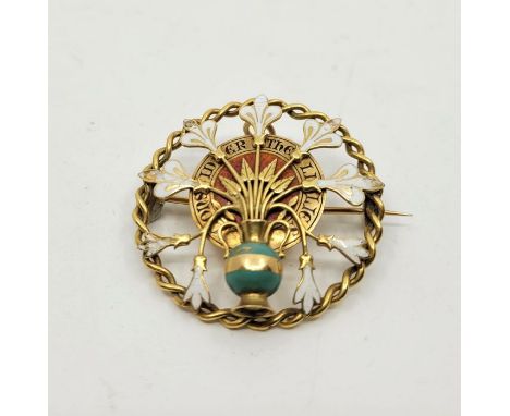 A precious yellow metal and cloisonne enamel brooch, (yellow metal assessed as 18ct. gold), diameter 40mm. (gross weight 12.0
