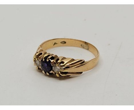 A French 18ct. gold, diamond and amethyst ring, set round cut amethyst to centre and round brilliant cut diamond to either si