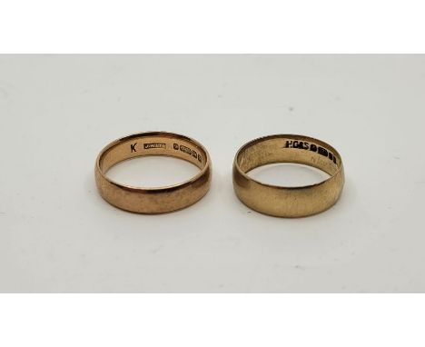 Two 9ct. yellow gold bands, Sizes UK K 1/2 &amp; J. (total 4.5g). (2)