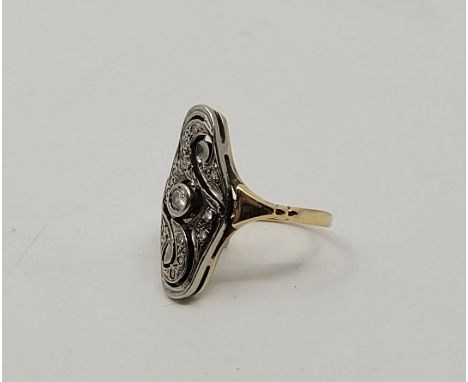 A 15ct. gold and diamond set ring, having pierced navette form head bezel set round cut diamond to centre and smaller round c