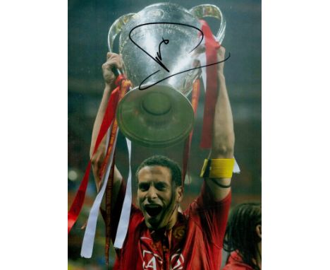 Rio Ferdinand signed 12x8 inch colour photo pictured with the Champions league trophy while playing for Manchester United. Go