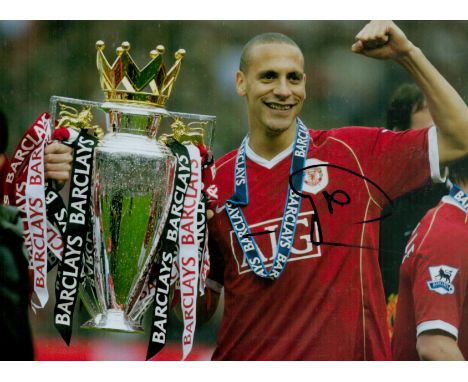 Rio Ferdinand signed 12x8 inch colour photo pictured with the Premier League trophy while playing for Manchester United. Good