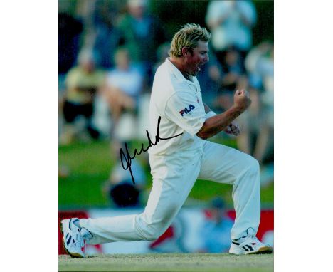 Shane Warne signed 10x8 inch colour photo pictured celebrating while playing test match cricket for Australia. Good condition