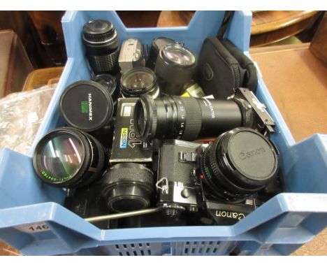 Canon A1 SLR camera with lens together with a quantity of various other Macro and zoom lenses and various camera accessories
