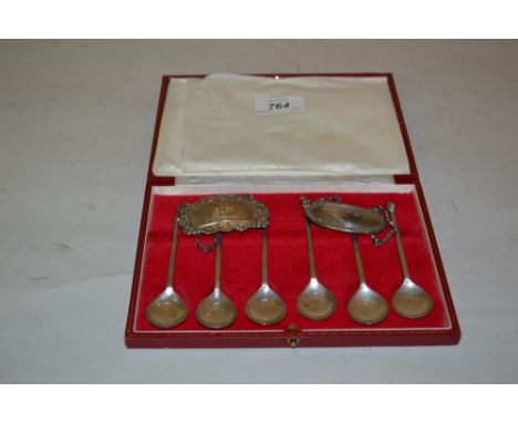 Cased set of six London silver coffee spoons together with two silver decanter labels