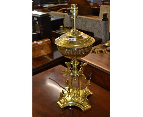 Brass Aesthetic Movement oil lamp base having foliate decoration on shaped plinth base (converted to electricity)