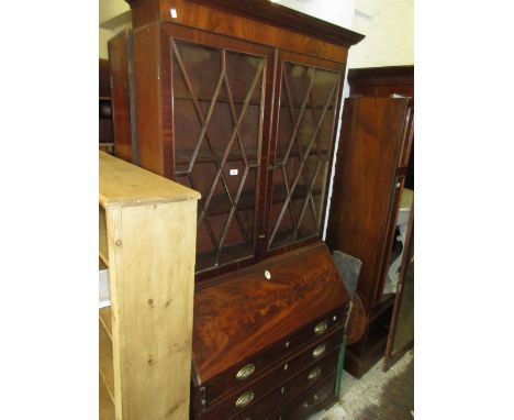 George III mahogany bureau bookcase, the moulded cornice above a pair of astragal glazed doors, the base with a fall front en