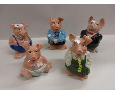Set of five Wade National Westminster piggy banks, Poole Pottery biscuit barrel, bowl and vase