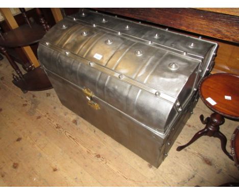 19th Century polished steel dome topped trunk with studded decoration and brass lock, with original blue painted interior