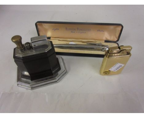 Cased Ronson penciliter, a Ronson Touch-Tip table lighter and another musical cigarette lighter
