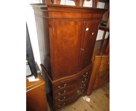 Reproduction mahogany serpentine fronted cabinet on chest having two panelled doors above brushing slide and four long drawer