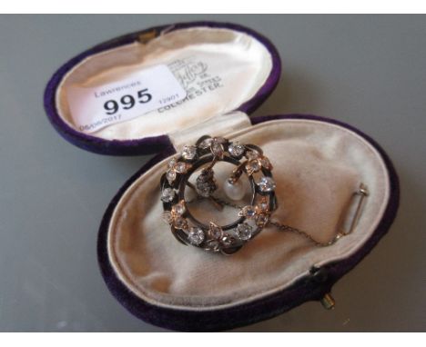 Antique circular gold brooch, set with old cut diamonds and natural pearl, housed in a purple velvet box