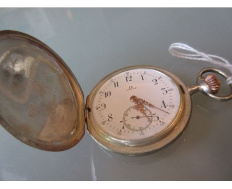 Silver cased full hunter pocket watch by Omega, the enamel dial with Arabic numerals and subsidiary seconds with a keyless le