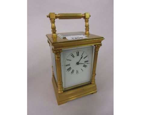 20th Century gilt brass cased carriage clock having enamel dial with Roman numerals and two train movement striking on a gong