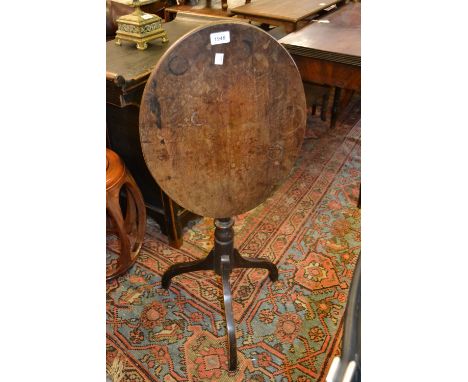 George III oval mahogany tilt-top pedestal wine table on tripod support