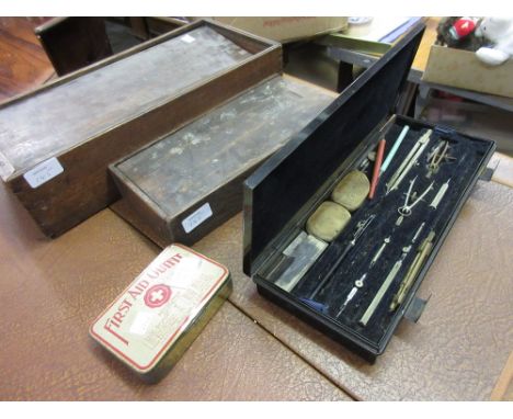Black metal cased drawing instruments set, two wooden boxes (a/f) and a First Aid outfit in original tin