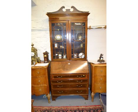 Edwardian mahogany and chequer line inlaid bureau bookcase, the moulded cornice above a pair of bar glazed doors enclosing sh