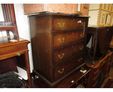 Small 20th Century mahogany and crossbanded four drawer straight front chest with brass handles raised on bracket feet