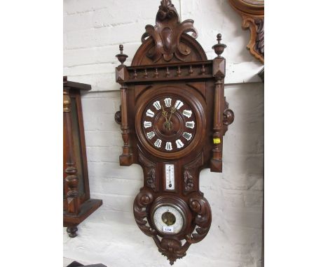Late 19th Century French carved walnut vineyard clock with thermometer and barometer, with a two train movement striking on a