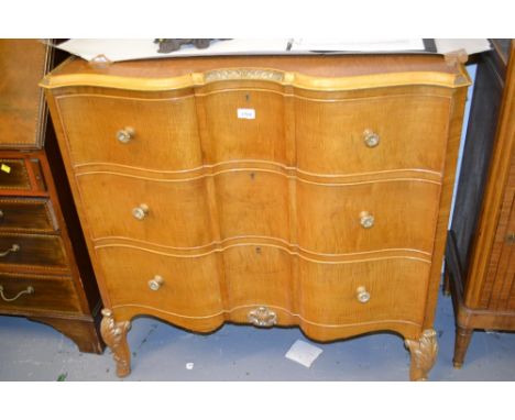 Pair of Continental satin birch serpentine fronted commode chests, each with a carved and moulded tray top above three short 