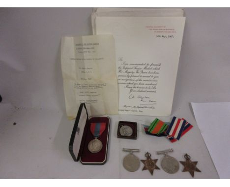 Group of four World War II service medals, together with an Elizabeth II Imperial service medal awarded to Lionel Rupert Tayl