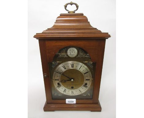 Reproduction mahogany three train bracket clock retailed by Garrard and Co.