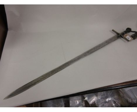 Sudanese steel bladed sword with leather grip, 35ins long (lacking scabbard)