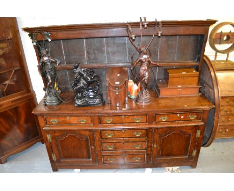 George III oak dresser with a low boarded shelf back above three mahogany crossbanded drawers, three further centre drawers f