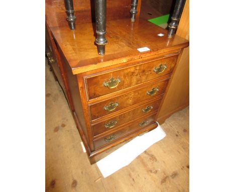 Small reproduction mahogany and crossbanded four drawer straight front chest on bracket feet