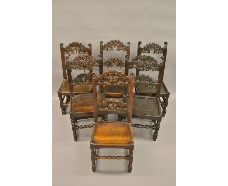 Harlequin set of six 17th / 18th Century oak Derbyshire type ladder back dining chairs, the carved backs above panelled seats