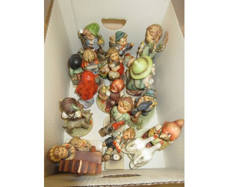 Group of twelve Goebel Hummell figures of children, similar figure of a baby in a cradle together with four other figures (a/