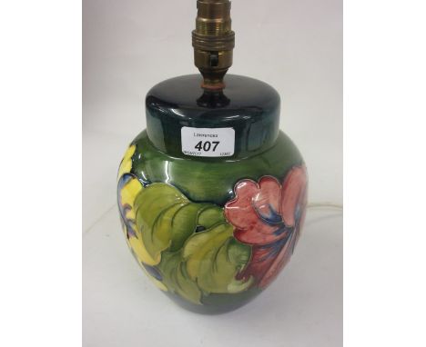Late 20th Century Moorcroft Hibiscus pattern baluster form lamp base with green and blue ground, 8ins high